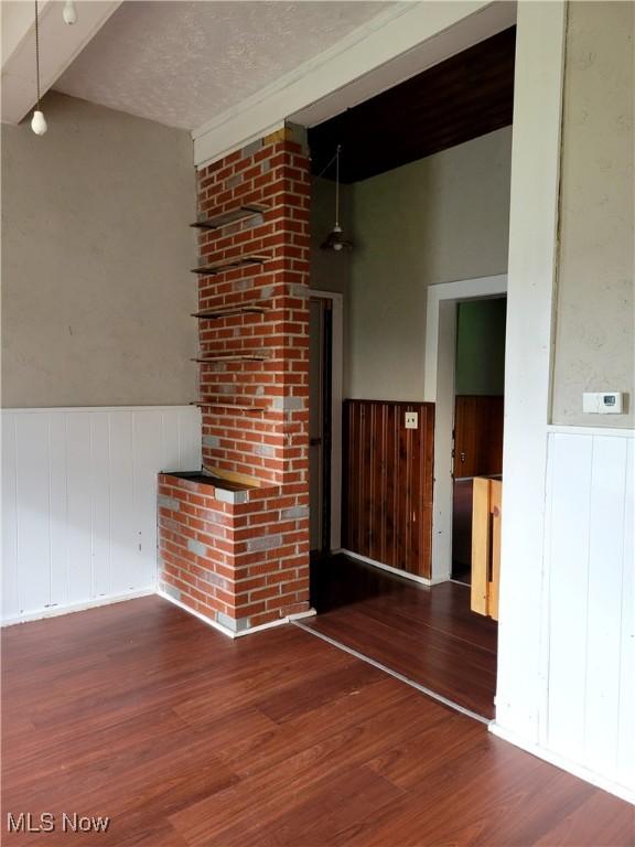 217 E 4th St, Warsaw, OH 43844 - spare room with wood finished floors and wainscoting