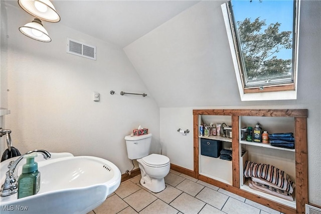 1173 Ridge Rd, Salem, OH 44460 - bathroom with lofted ceiling, tile patterned flooring, and a skylight