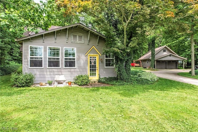1173 Ridge Rd, Salem, OH 44460 - view of front facade with a garage, a front yard, a chimney, and driveway
