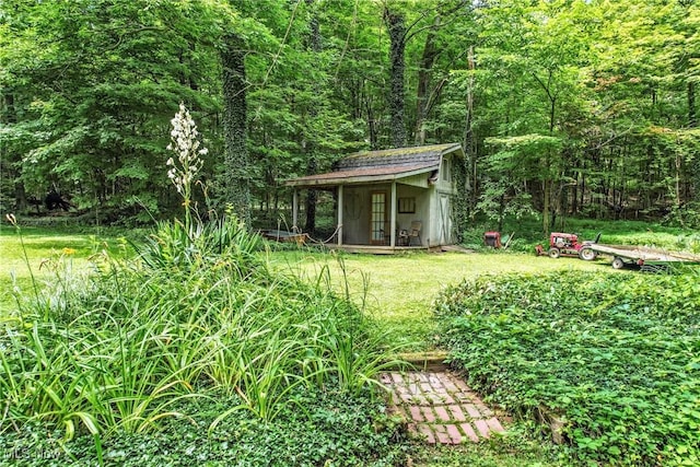 1173 Ridge Rd, Salem, OH 44460 - view of grassy yard featuring a forest view and a storage unit