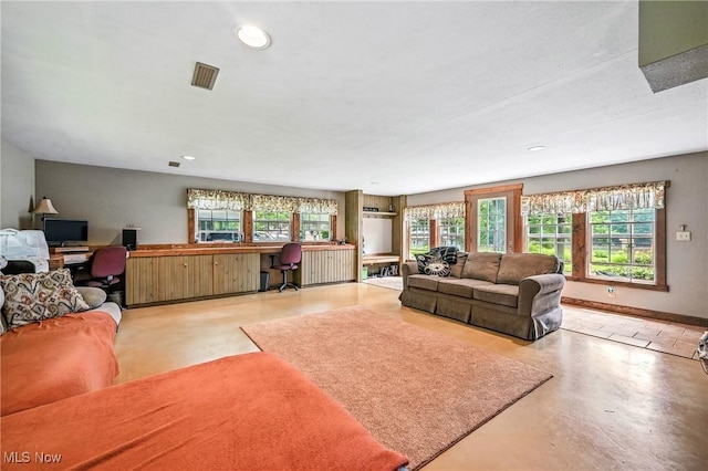 1173 Ridge Rd, Salem, OH 44460 - living area with a desk, plenty of natural light, finished concrete floors, and recessed lighting