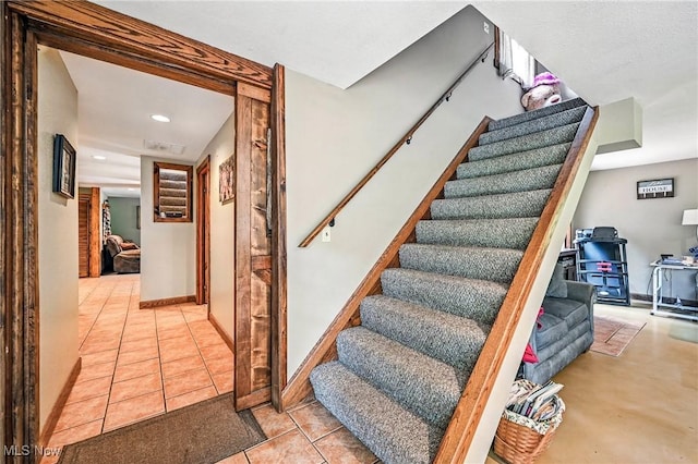 1173 Ridge Rd, Salem, OH 44460 - stairs with tile patterned flooring, a wood stove, and recessed lighting