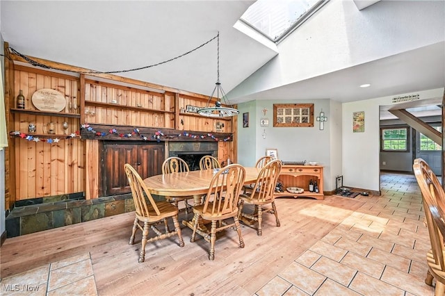 1173 Ridge Rd, Salem, OH 44460 - dining room featuring a skylight, lofted ceiling, and light wood-style floors