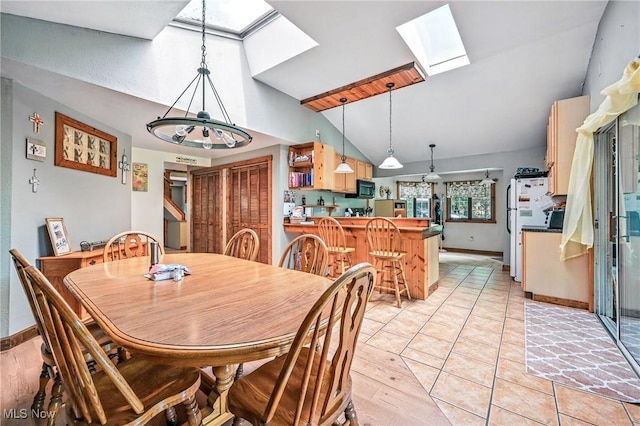 1173 Ridge Rd, Salem, OH 44460 - dining space with a chandelier, a skylight, and high vaulted ceiling