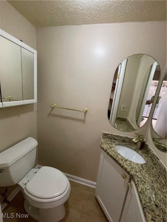6466 Concord Rd Unit M4, Parma, OH 44134 - bathroom with vanity and a textured ceiling