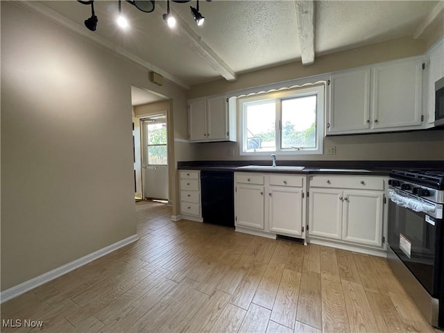 6466 Concord Rd Unit M4, Parma, OH 44134 - kitchen featuring stainless steel appliances, dark countertops, light wood-style flooring, white cabinets, and beamed ceiling
