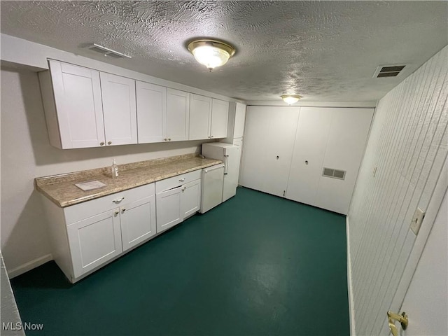 6466 Concord Rd Unit M4, Parma, OH 44134 - basement with a textured ceiling and fridge