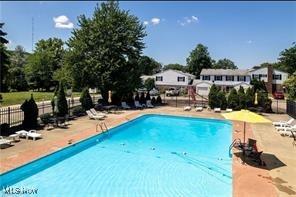 6466 Concord Rd Unit M4, Parma, OH 44134 - community pool featuring a patio area
