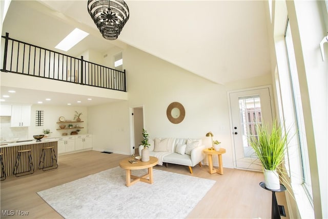 7142 N Oxshire Pl, Concord, OH 44077 - living area featuring light wood-type flooring and high vaulted ceiling