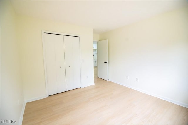 7142 N Oxshire Pl, Concord, OH 44077 - unfurnished bedroom with light wood-style floors and a closet