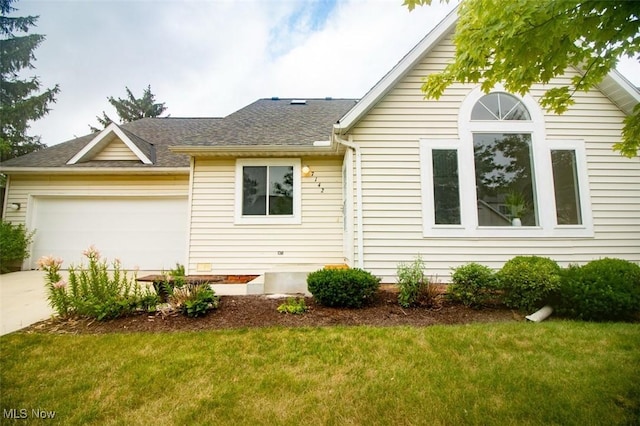 7142 N Oxshire Pl, Concord, OH 44077 - view of front of property featuring a garage, a front lawn, concrete driveway, and a shingled roof