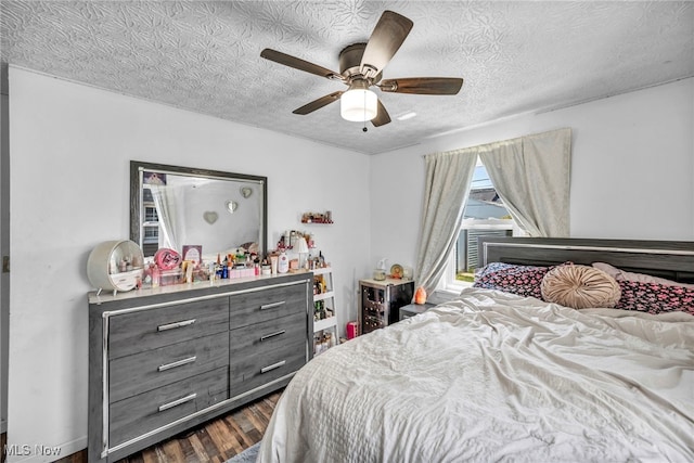29100 Weber Ave, Wickliffe, OH 44092 - bedroom with dark wood-style floors, a textured ceiling, and ceiling fan