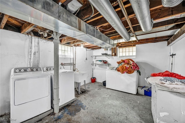 29100 Weber Ave, Wickliffe, OH 44092 - below grade area with washing machine and clothes dryer and healthy amount of natural light