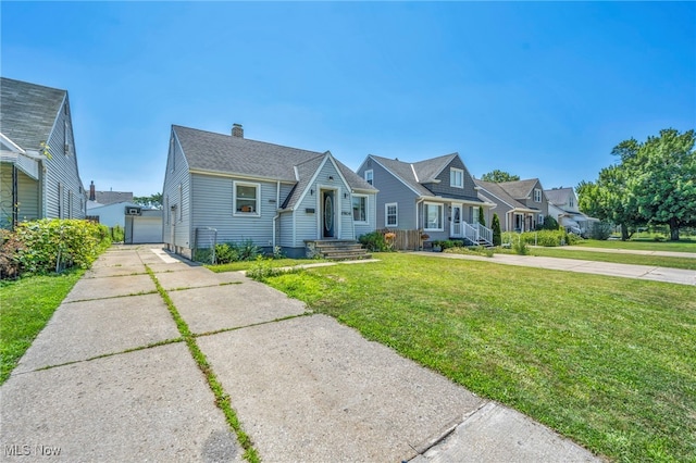 29100 Weber Ave, Wickliffe, OH 44092 - view of front of home featuring a front lawn, a chimney, and a detached garage