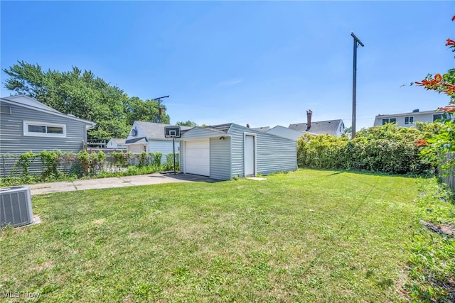 29100 Weber Ave, Wickliffe, OH 44092 - view of green lawn with an outdoor structure, a detached garage, and concrete driveway