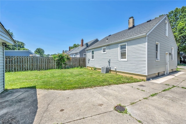 29100 Weber Ave, Wickliffe, OH 44092 - back of house with a chimney, a patio area, and a shingled roof