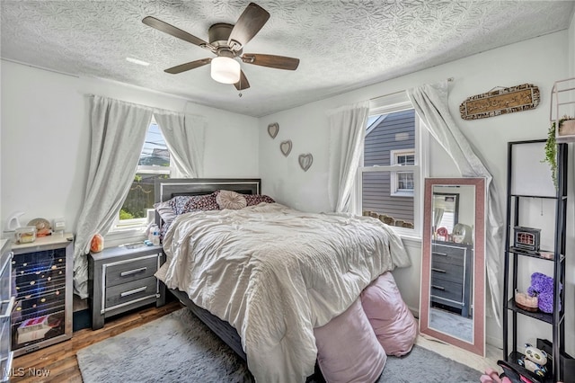29100 Weber Ave, Wickliffe, OH 44092 - bedroom with wood finished floors, a ceiling fan, and a textured ceiling