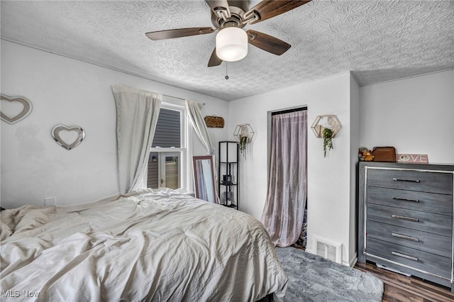 29100 Weber Ave, Wickliffe, OH 44092 - bedroom with dark wood finished floors, ceiling fan, and a textured ceiling