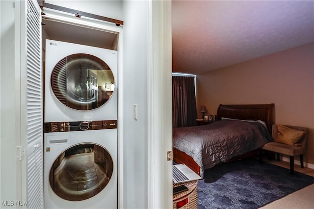 985 Canyon View Rd Unit 204C, Northfield, OH 44067 - laundry room with stacked washer / dryer and carpet floors