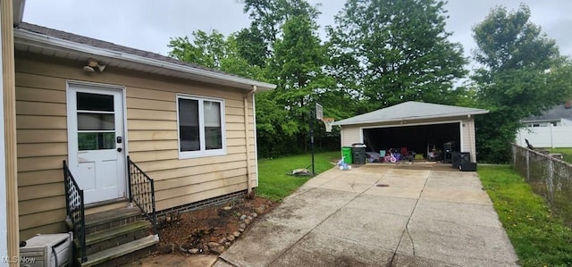 963 Chelston Rd, South Euclid, OH 44121 - view of home's exterior with entry steps, a garage, and an outdoor structure