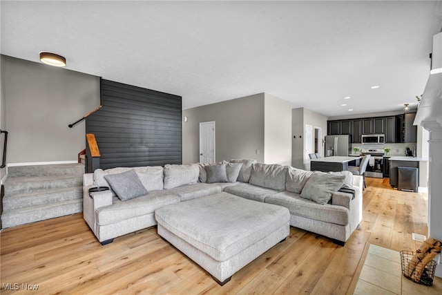 1383 Easton Way, Brunswick, OH 44212 - living room featuring light wood-style flooring, stairway, and recessed lighting