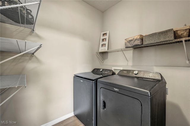 1383 Easton Way, Brunswick, OH 44212 - laundry area with washer and clothes dryer and light wood finished floors