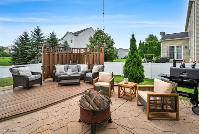 1383 Easton Way, Brunswick, OH 44212 - fenced backyard featuring an outdoor living space with a fire pit, a patio, and a wooden deck