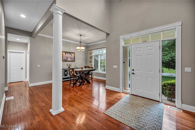 7955 Forest Valley Ln, Concord, OH 44077 - foyer entrance featuring hardwood / wood-style floors, decorative columns, crown molding, a chandelier, and recessed lighting