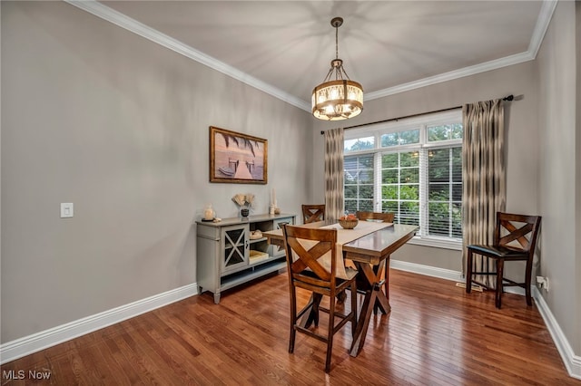 7955 Forest Valley Ln, Concord, OH 44077 - dining room with a chandelier, wood finished floors, and crown molding