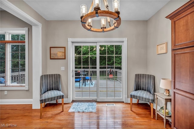 7955 Forest Valley Ln, Concord, OH 44077 - doorway featuring a chandelier and light wood finished floors