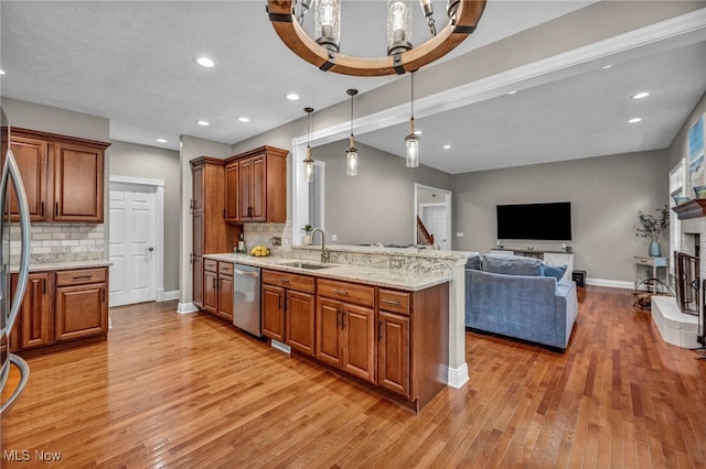 7955 Forest Valley Ln, Concord, OH 44077 - kitchen with stainless steel dishwasher, light wood-style flooring, brown cabinets, a peninsula, and recessed lighting