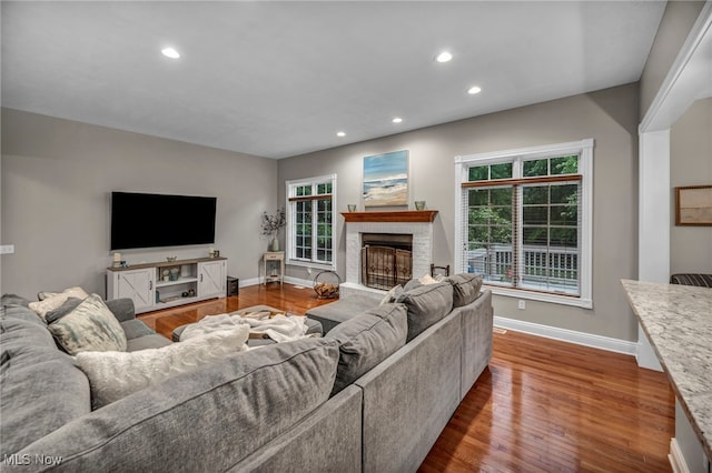 7955 Forest Valley Ln, Concord, OH 44077 - living room with recessed lighting, plenty of natural light, wood finished floors, and a fireplace