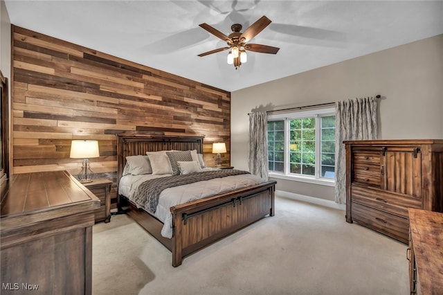 7955 Forest Valley Ln, Concord, OH 44077 - bedroom featuring wooden walls, light colored carpet, and a ceiling fan