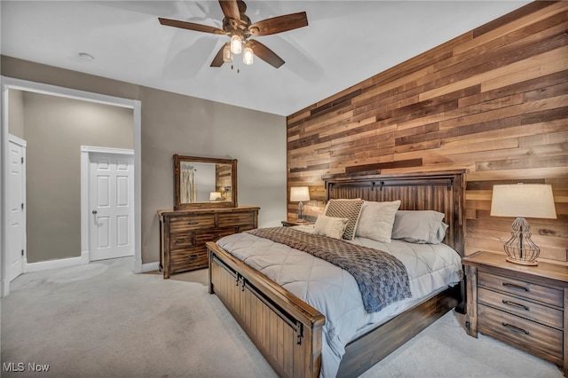 7955 Forest Valley Ln, Concord, OH 44077 - bedroom featuring wooden walls, light colored carpet, and ceiling fan