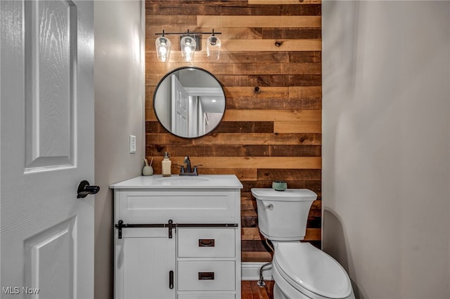 7955 Forest Valley Ln, Concord, OH 44077 - half bathroom featuring wood walls and vanity