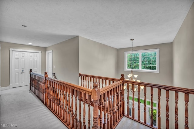 7955 Forest Valley Ln, Concord, OH 44077 - hall with an upstairs landing, a chandelier, a textured ceiling, and recessed lighting
