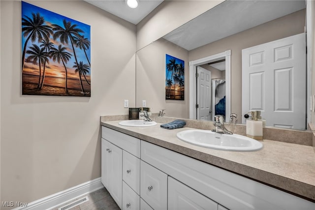7955 Forest Valley Ln, Concord, OH 44077 - bathroom with double vanity and tile patterned floors