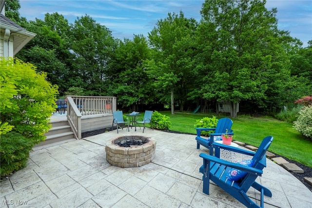 7955 Forest Valley Ln, Concord, OH 44077 - view of patio with an outdoor fire pit, a deck, a playground, and view of scattered trees