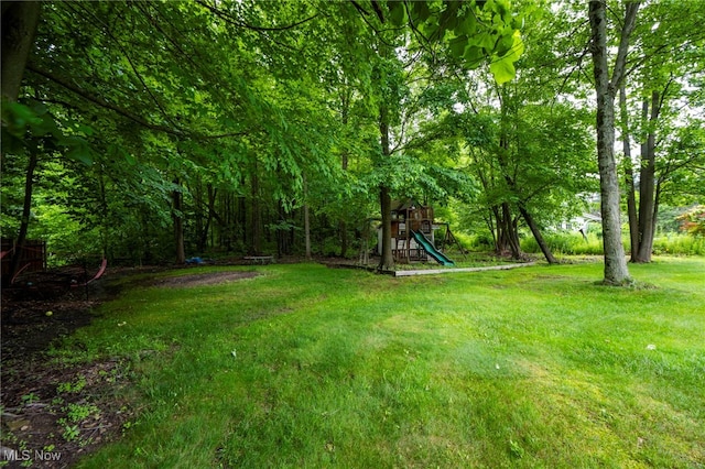 7955 Forest Valley Ln, Concord, OH 44077 - view of grassy yard featuring a playground