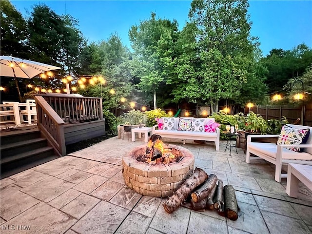 7955 Forest Valley Ln, Concord, OH 44077 - view of patio featuring a fire pit and a wooden deck