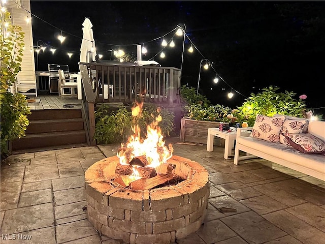 7955 Forest Valley Ln, Concord, OH 44077 - patio at twilight with a fire pit, a deck, and a patio