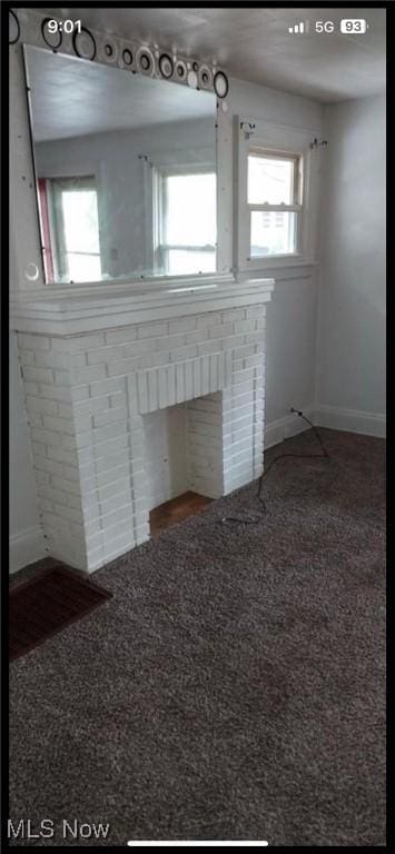 1405 Brandon Ave, Akron, OH 44305 - unfurnished living room featuring plenty of natural light and carpet floors