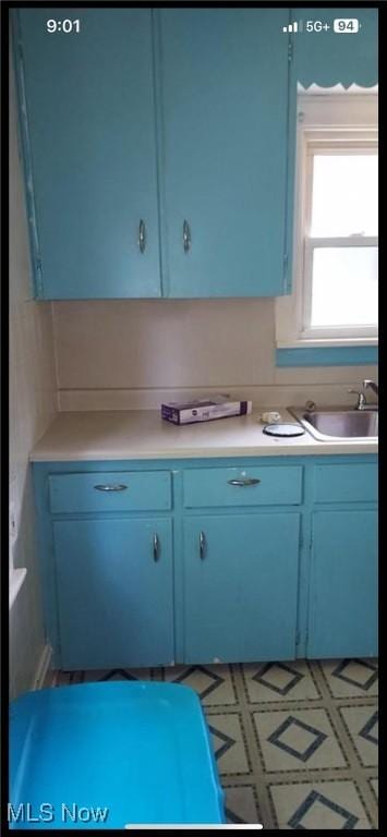1405 Brandon Ave, Akron, OH 44305 - kitchen featuring blue cabinetry and light countertops