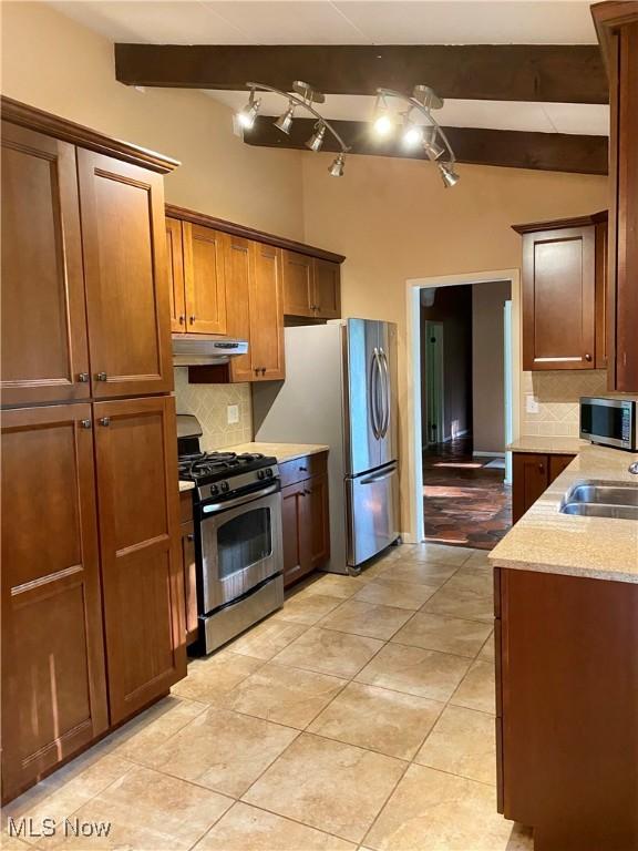 17079 Cats Den Rd, Chagrin Falls, OH 44023 - kitchen featuring appliances with stainless steel finishes, under cabinet range hood, decorative backsplash, and light tile patterned floors