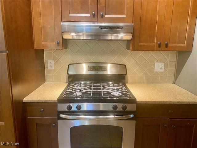 17079 Cats Den Rd, Chagrin Falls, OH 44023 - kitchen with gas range, range hood, backsplash, and light stone countertops