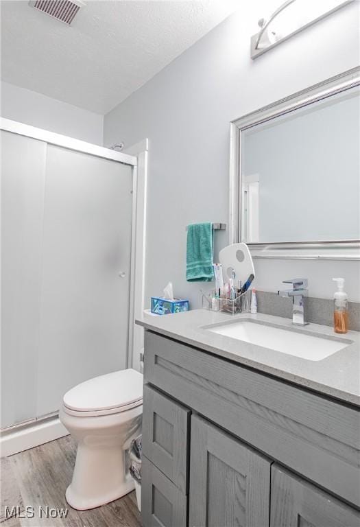 2262 Pine Top Ct Unit 31, Akron, OH 44319 - full bathroom featuring vanity, a stall shower, and wood finished floors
