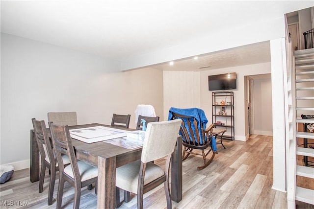 2262 Pine Top Ct Unit 31, Akron, OH 44319 - dining area featuring light wood-type flooring and stairs