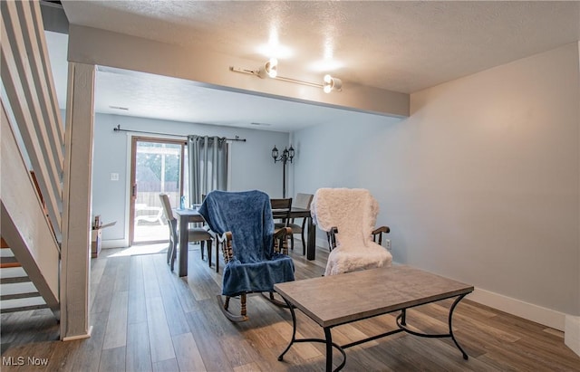 2262 Pine Top Ct Unit 31, Akron, OH 44319 - dining room featuring a textured ceiling, wood finished floors, and stairway