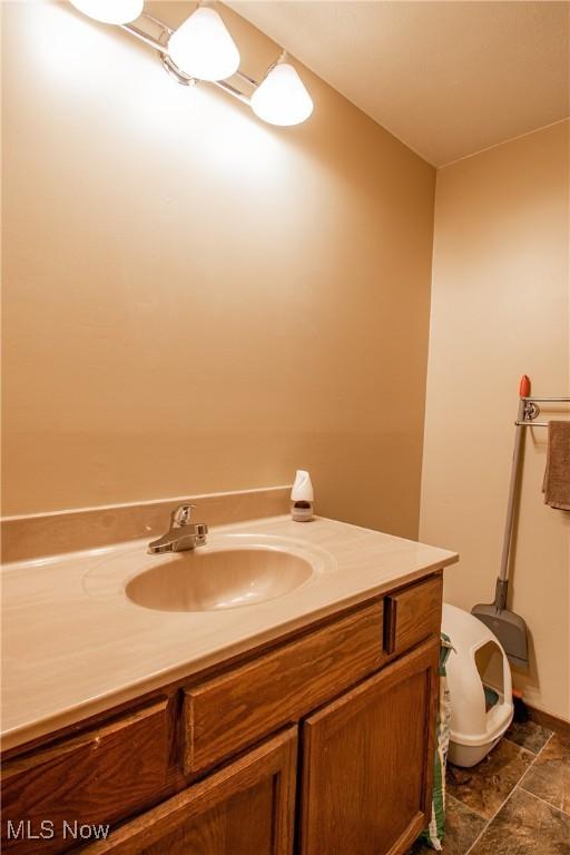 2262 Pine Top Ct Unit 31, Akron, OH 44319 - half bath with vanity and stone finish flooring