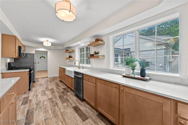 3695 S Hametown Rd, Norton, OH 44203 - kitchen with open shelves, stainless steel dishwasher, range with gas stovetop, and plenty of natural light